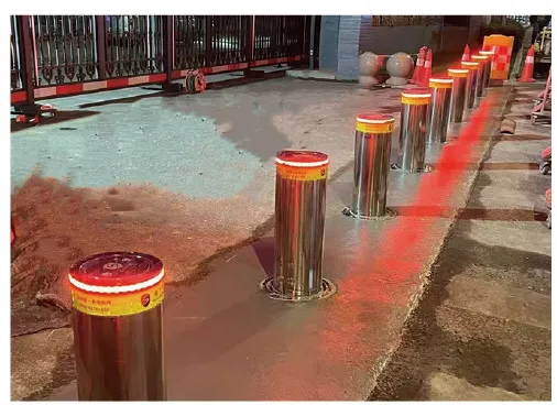 Automatic rising bollards with illuminated LED warning lights during testing