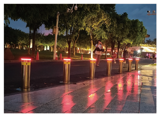 LED automatic rising bollards at an evening pedestrian street